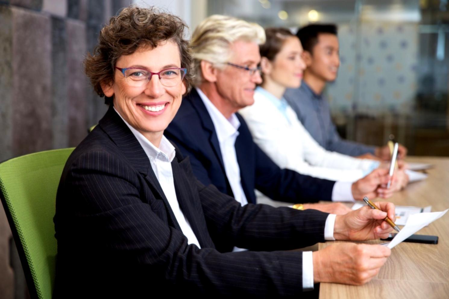 Students collaborating in investment learning environment